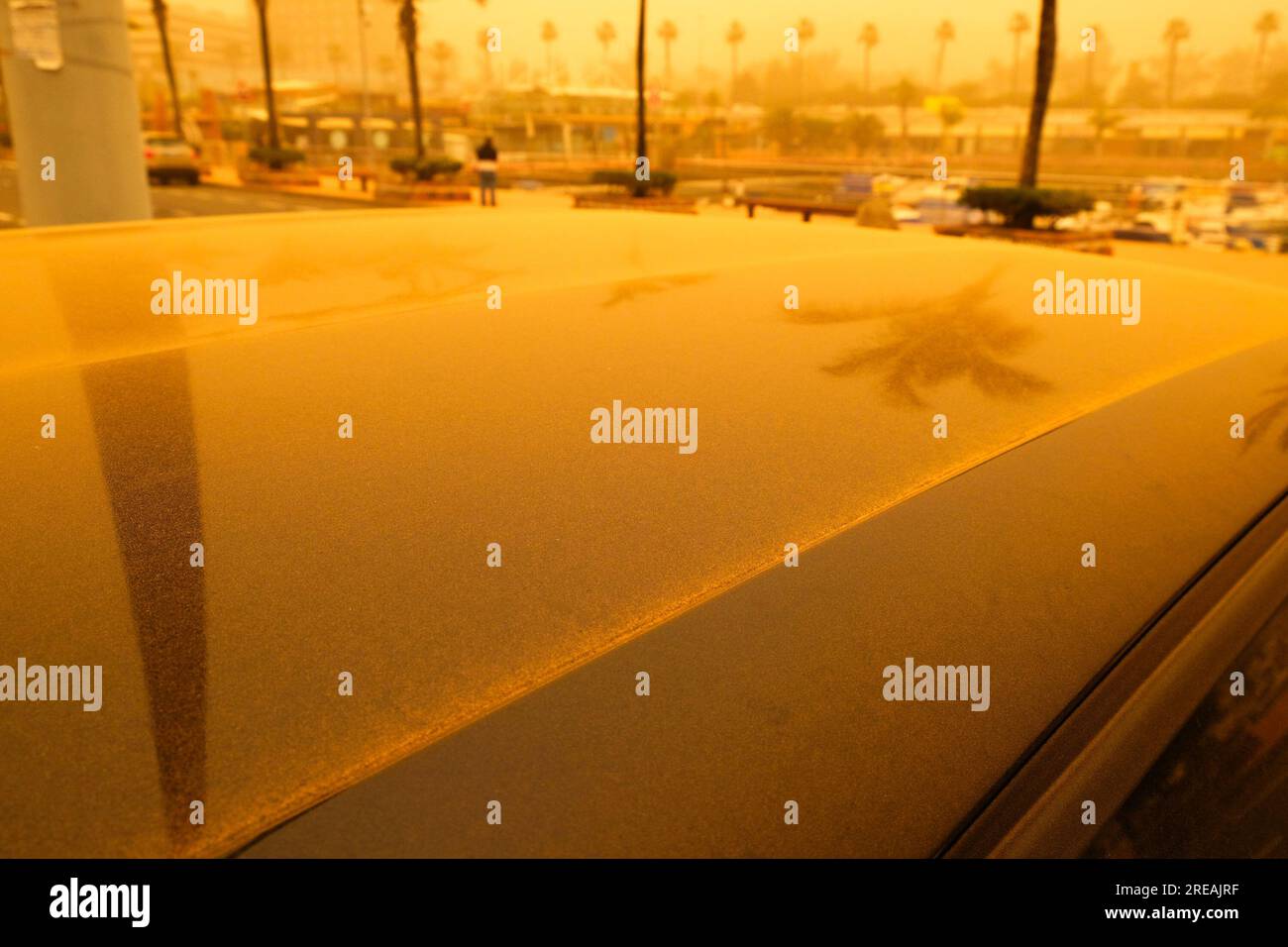 Las Palmas, Gran Canaria, Spain; February 23 2020 - Car top covered in Sahara desert dust, extreme weather conditions of calima, or calina, (English: Stock Photo