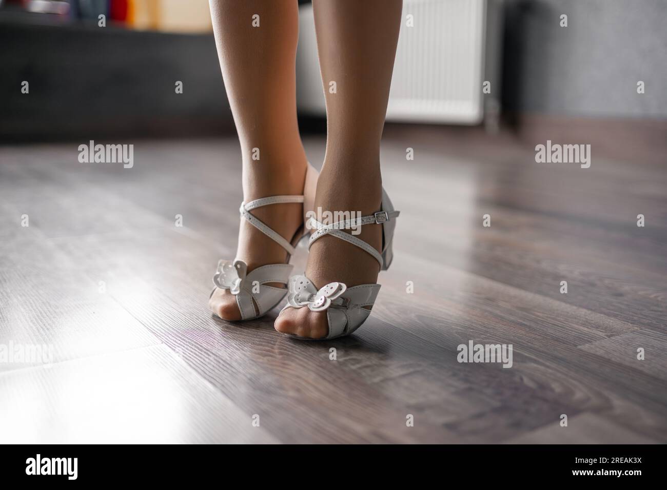 Close up side view of child foots in dancing shoes on the floor in studio. Dance training class for kids. Girls athlete concept Stock Photo Alamy