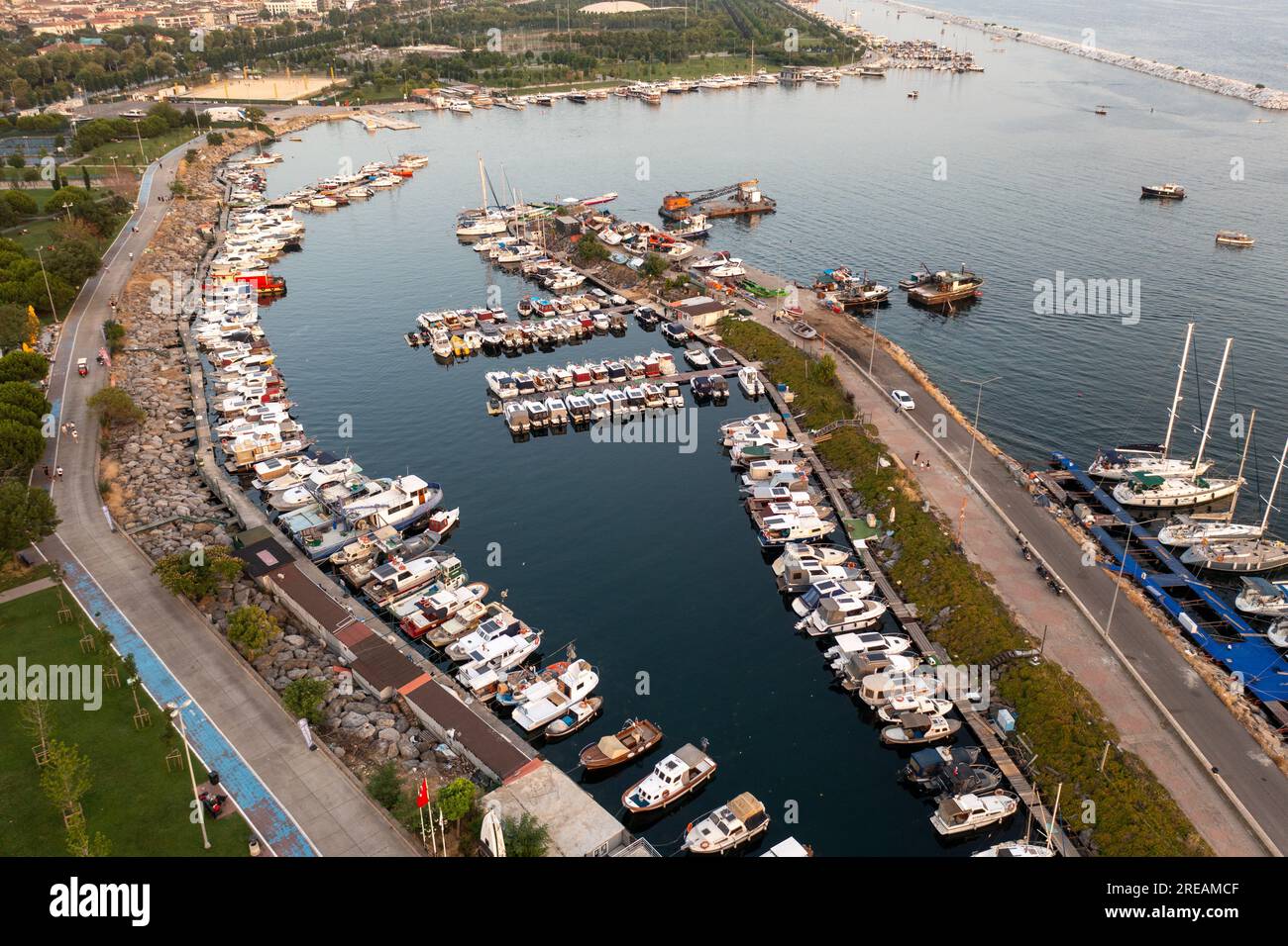 Drone view Maltepe Sahil at sunset. Aerial view of over park and harbor in Maltepe district on the Marmara Sea coast of the Asian side of Istanbul. Stock Photo