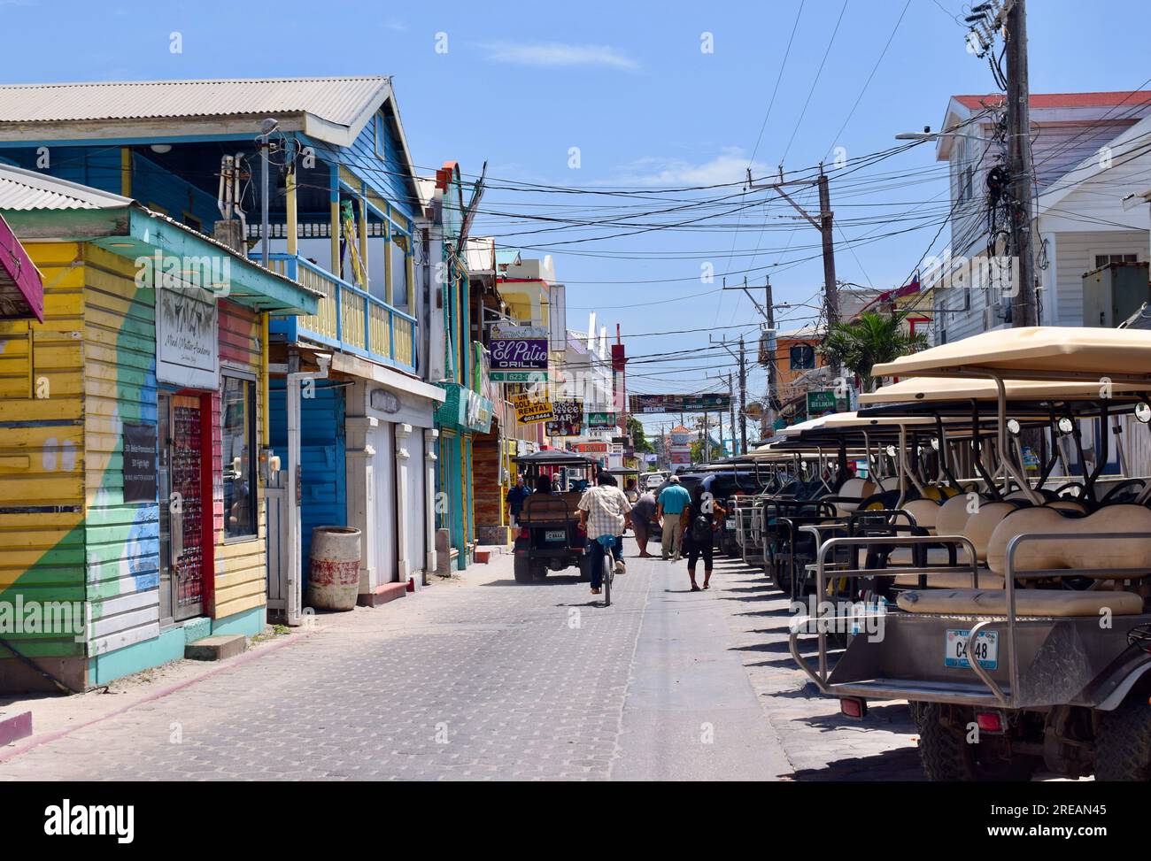 Front Street in San Pedro Town, with golf carts, shops, restaurants