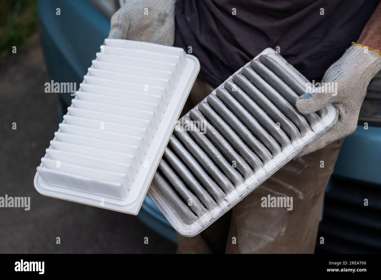 The master changes the air filter in the car engine Stock Photo Alamy