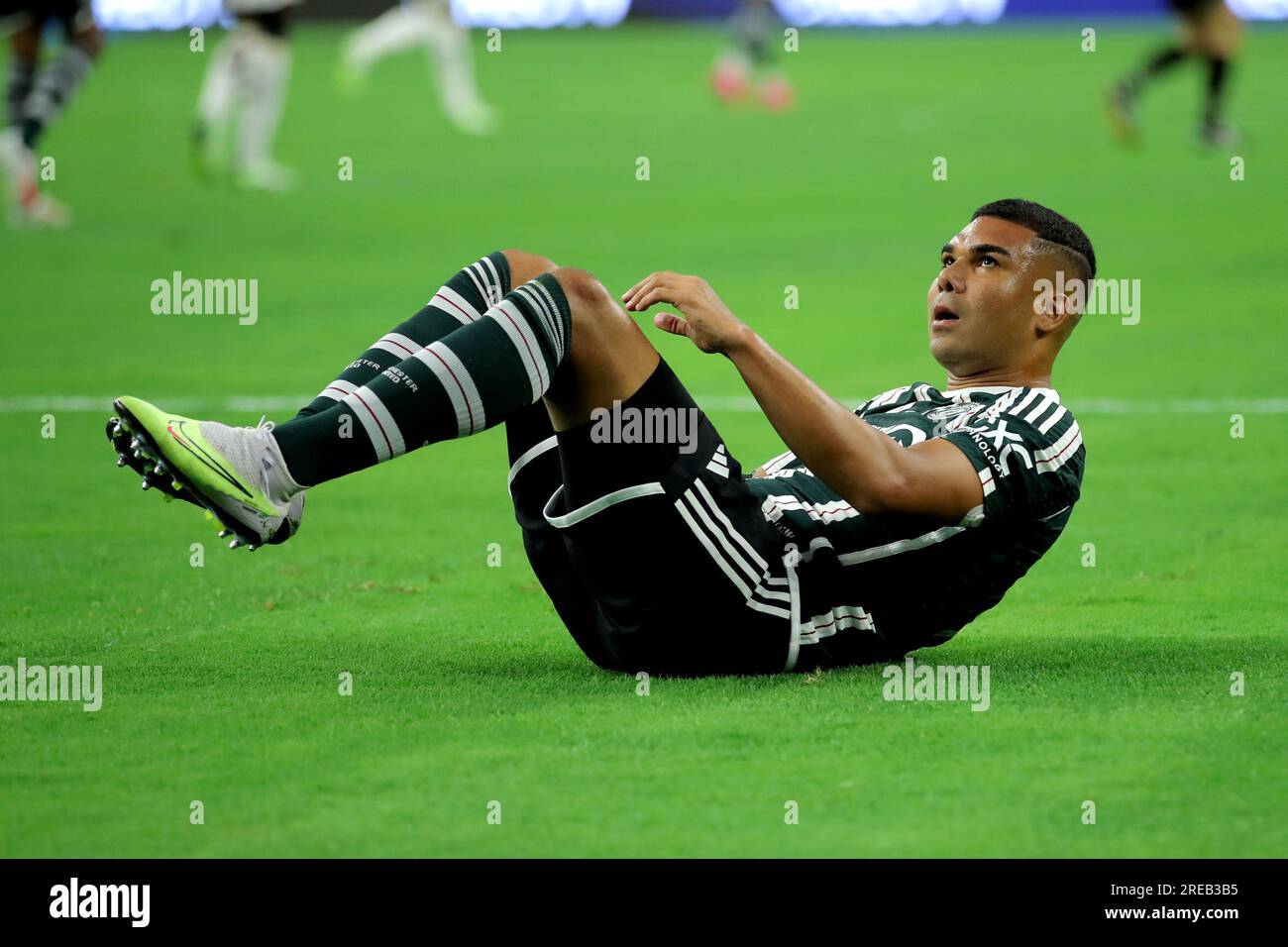 Houston, Texas, USA. 26th July, 2023. Manchester United FC midfielder Casemiro (18) sits on the turf during the first half of the Soccer Champions Tour match between Manchester United FC and Real Madrid CF at NRG Stadium in Houston, TX on July 26, 2023. (Credit Image: © Erik Williams/ZUMA Press Wire) EDITORIAL USAGE ONLY! Not for Commercial USAGE! Stock Photo