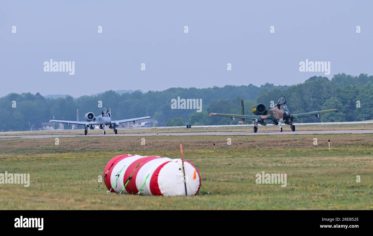 U.S. Air Force A-10C Thunderbolt IIs taxi down the runway at the Muskegon County Airport, in Muskegon, Michigan, July 6, 2023. The A-10 Demonstration Team brings a spare jet to each show in case of any maintenance issues.(U.S. Air Force photo by Staff Sgt. Nicholas Ross) Stock Photo