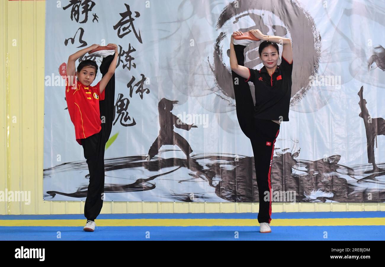 Students practice Chinese martial arts during the summer vacation in