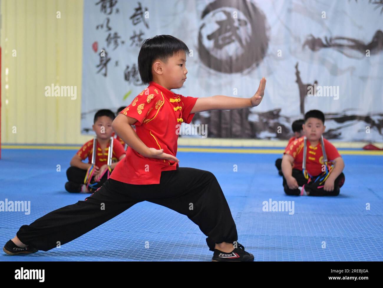 Students practice Chinese martial arts during the summer vacation in