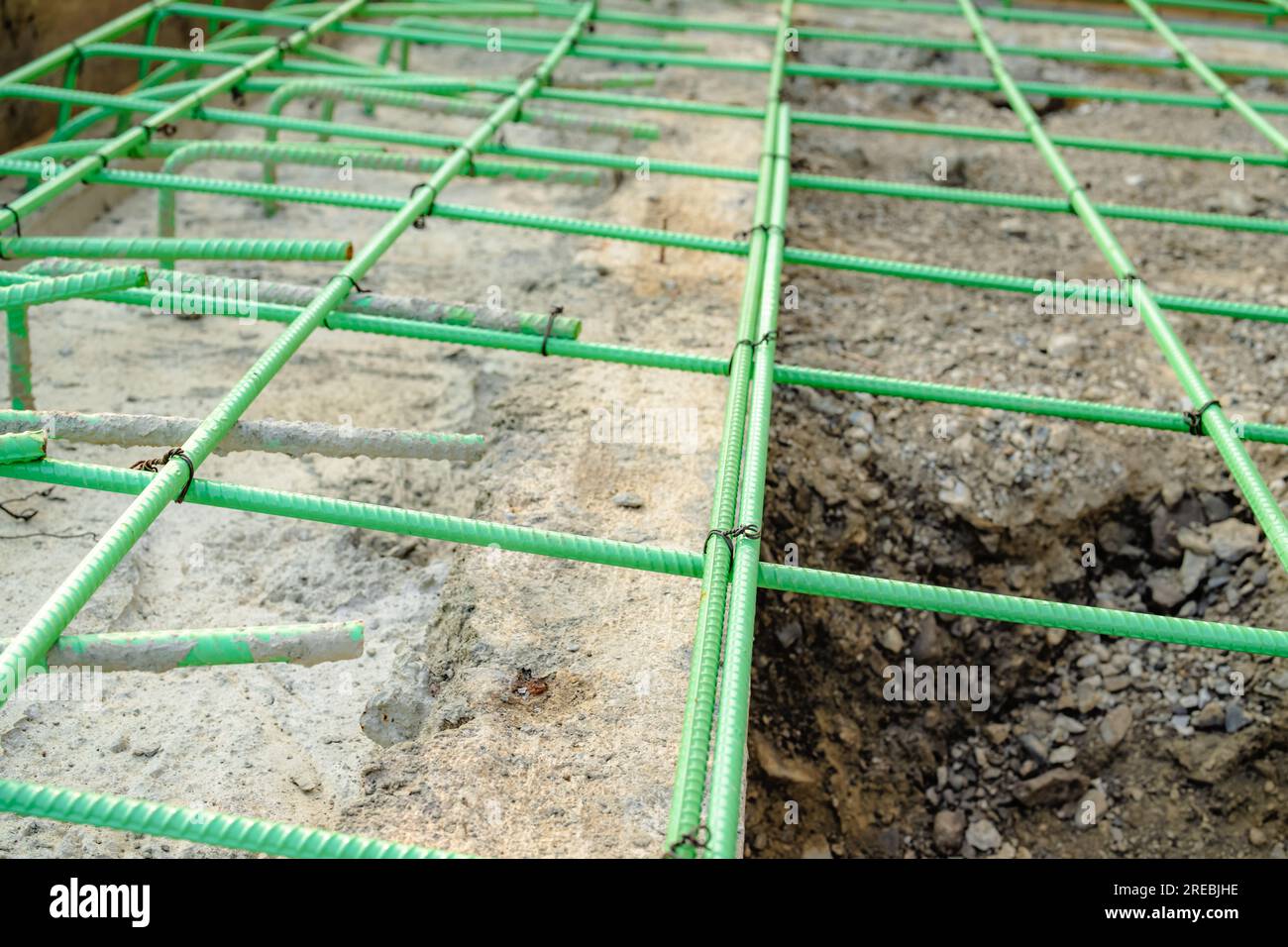 Epoxy coated rebar is used in concrete subjected to corrosive conditions. These may include exposure to deicing salts or marine environments. Stock Photo