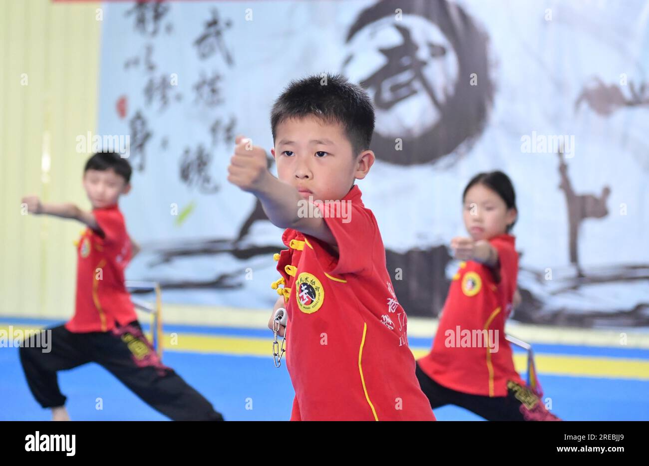 Students practice Chinese martial arts during the summer vacation in