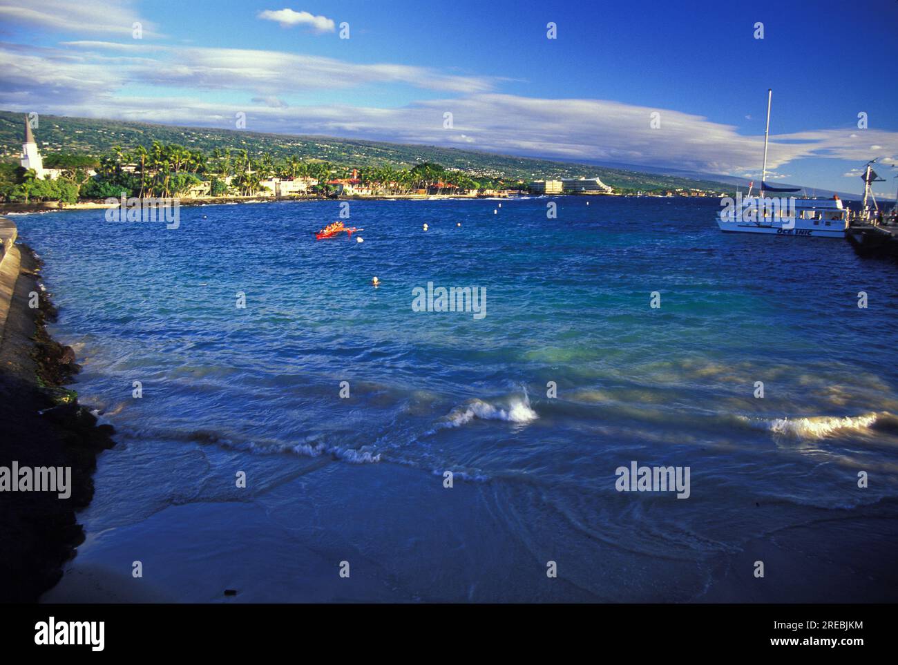 Beach area next to pier in Kailua Kona town Stock Photo