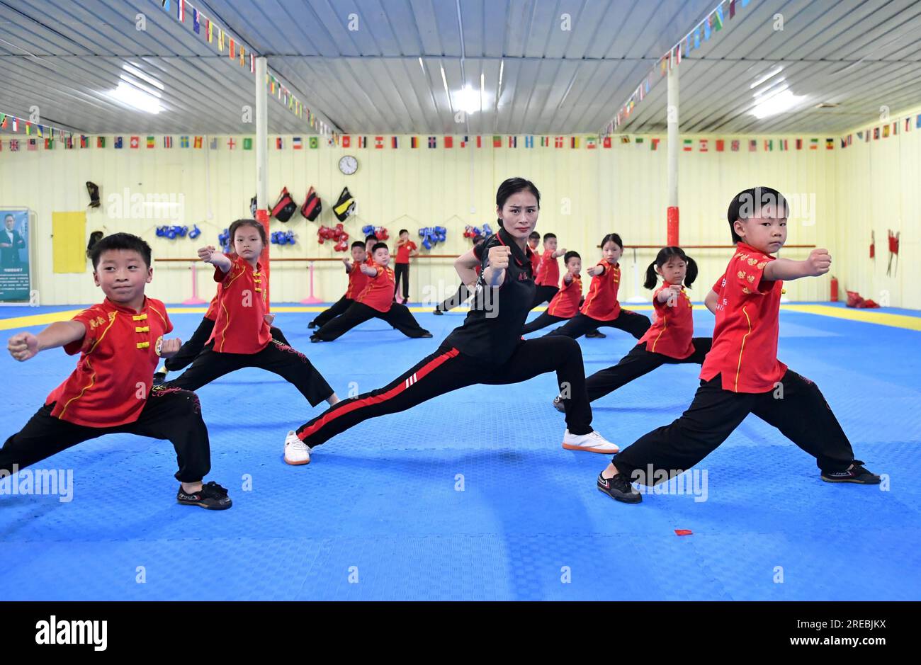Students practice Chinese martial arts during the summer vacation in