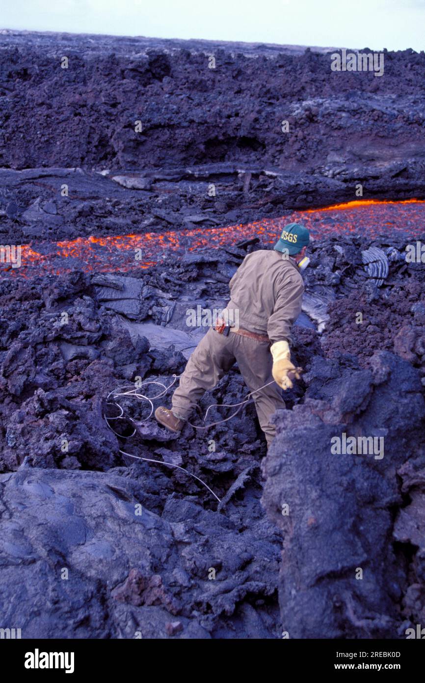 Volcanologist measuring lava flow from Kilauea, the worlds most active