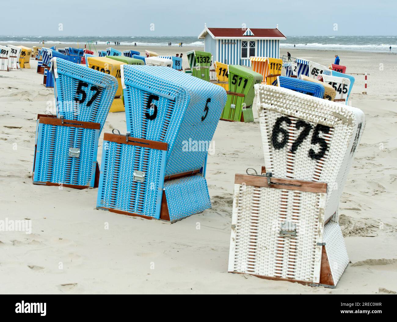 Colourful beach chairs on a cool day in the pre-season on the beach of Langeoog, East Frisian Islands, Lower Saxony, Germany Stock Photo