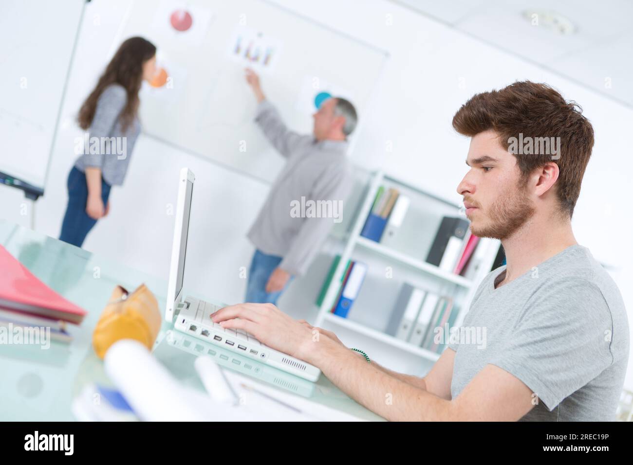 student-using-his-laptop-to-take-notes-stock-photo-alamy