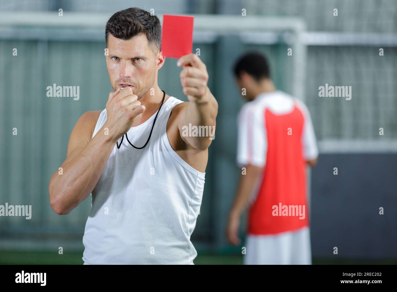 soccer referee showing red card during soccer match Stock Photo
