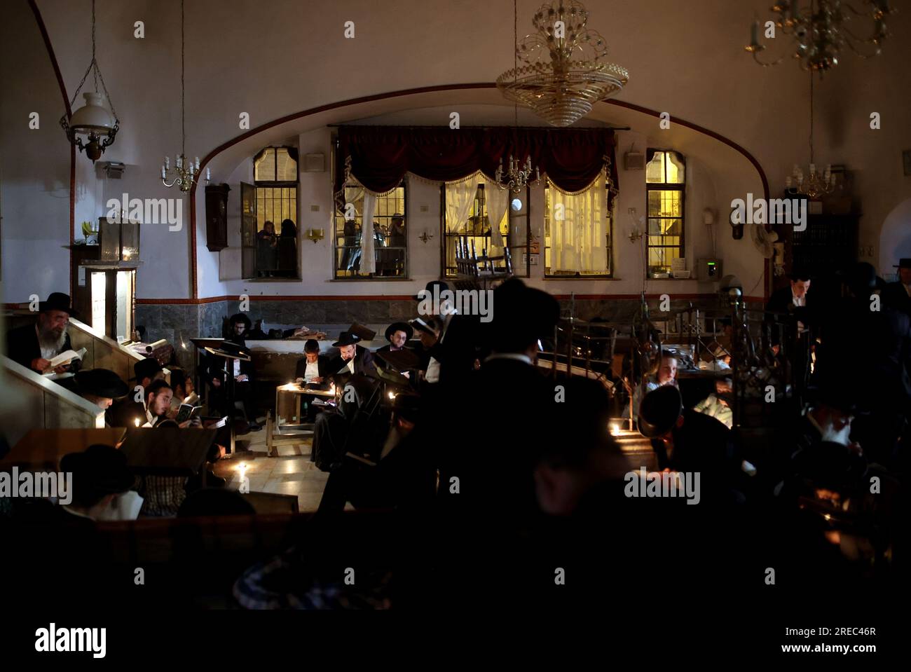 Jerusalem. 26th July, 2023. UltraOrthodox Jews light candles to read