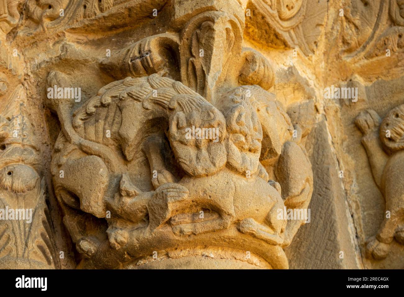 lions devouring a goat, Church of Santiago de Agüero, Agüero, Huesca, Spain Stock Photo