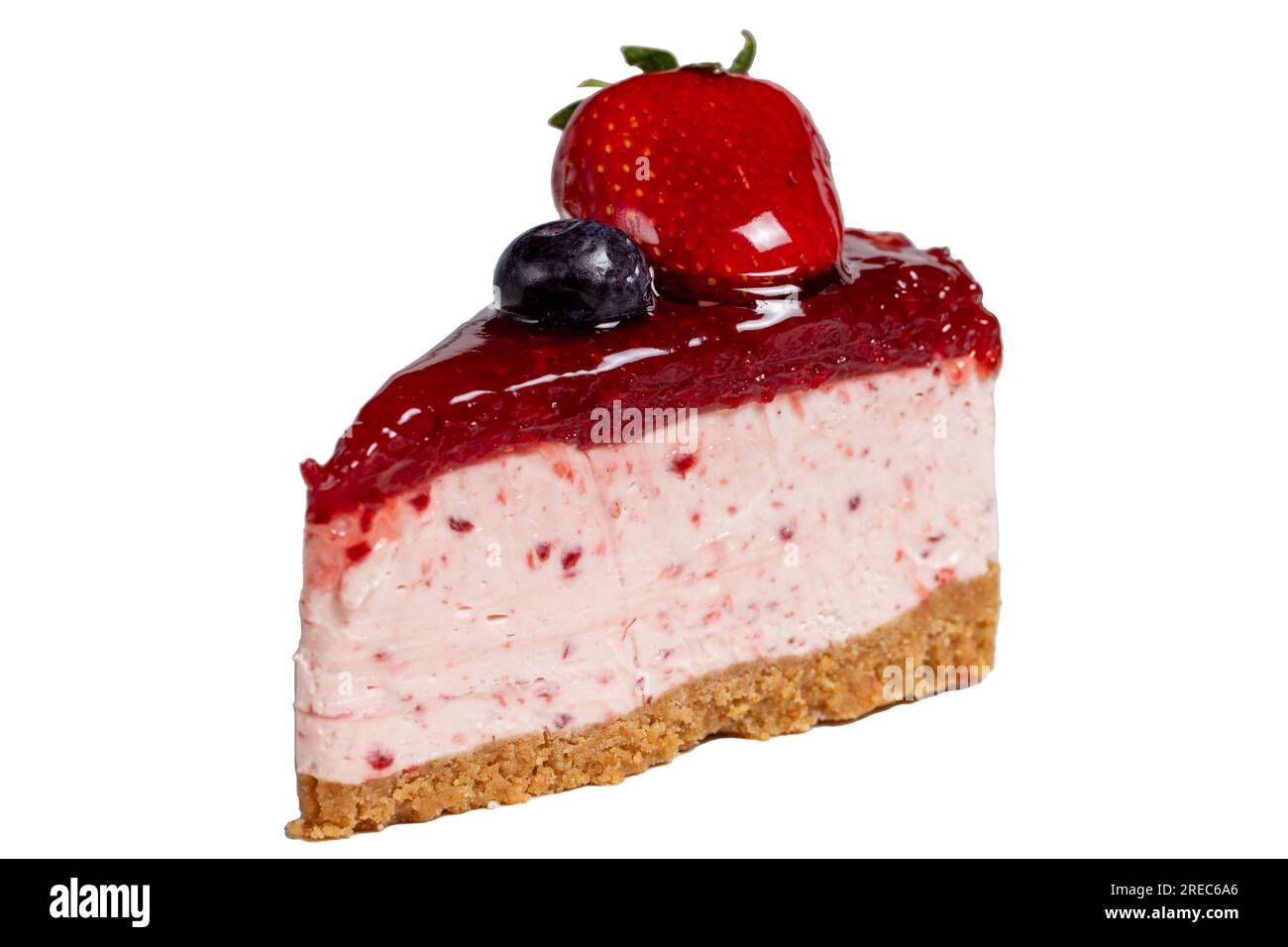 Fruit cake slice. Cheesecake slice with blackberry sauce isolated on white background. Close up Stock Photo
