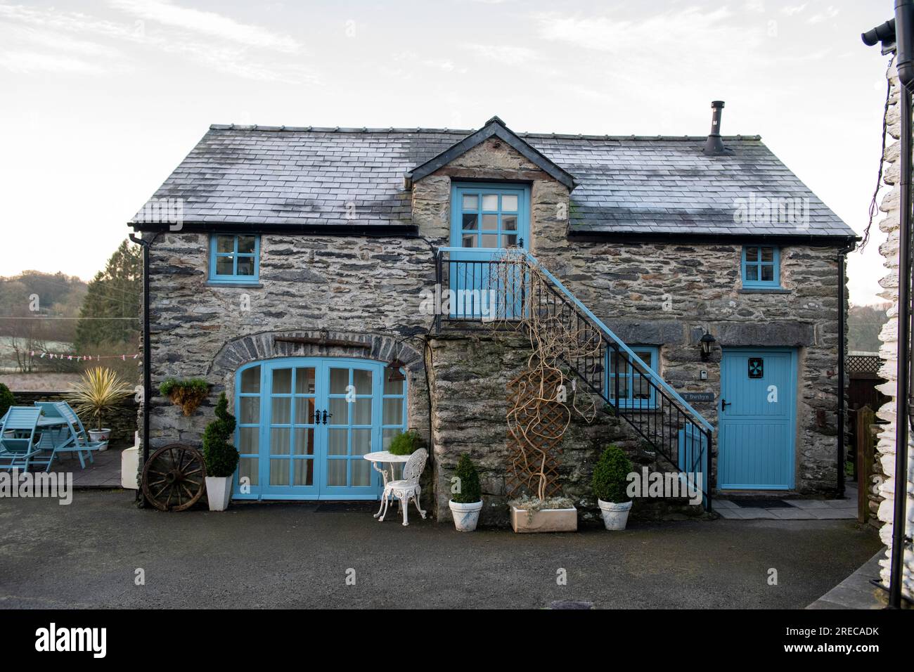 Stone holiday cottage for rent to tourists, Old coach house in Capel Garmon, within Snowdonia National Park Stock Photo