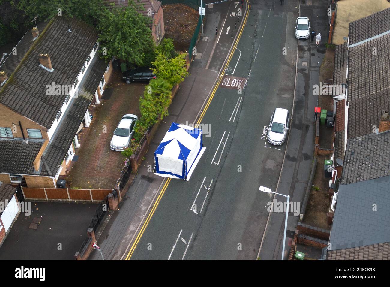 Harrow Street, Wolverhampton, 27th July 2023: West Midlands Police at the scene of a murder investigation which has been launched after two men were stabbed in the area of Harrow Street, Whitmore Reans in Wolverhampton on Thursday 27th July morning at 5am. A blue forensic tent was erected along with 3 small silver tents. A further white tent was placed on a nearby road covering what is believed to be a vehicle. One man suffered fatal injuries and was pronounced dead at the scene, another man has been taken to hospital with serious injuries. A man in his 20s has been detained. A cordon is in pl Stock Photo