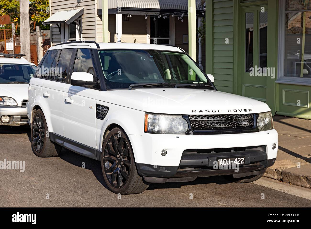 SUV Range Rover / A 2012 White Range Rover Sport HSE Wagon parked in