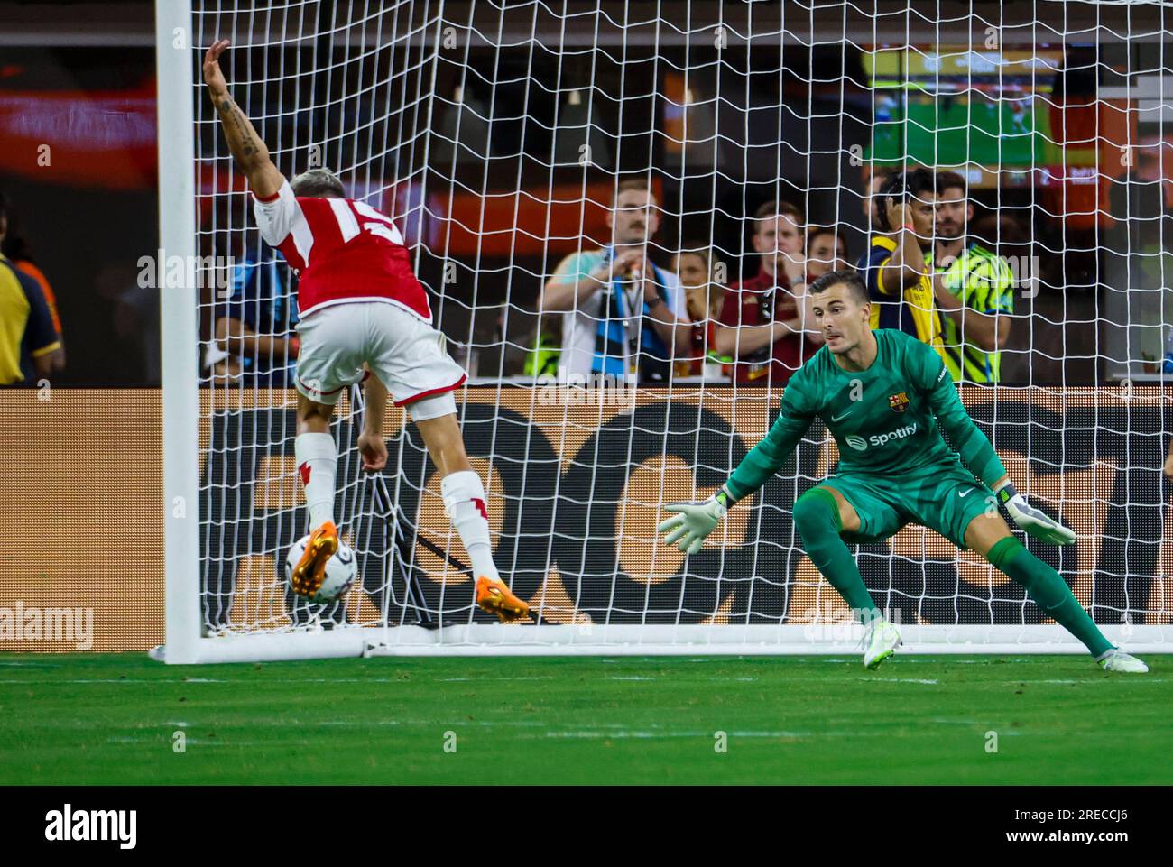 Los Angeles, United States. 26th July, 2023. Arsenal's Leandro Trossard (L) scores on Barcelona's goalkeeper Marc-André ter Stegen (R) in action during a Soccer Champions Tour match between the Arsenal F.C. and the FC Barcelona in Inglewood. Final score; Arsenal 5:3 Barcelona Credit: SOPA Images Limited/Alamy Live News Stock Photo