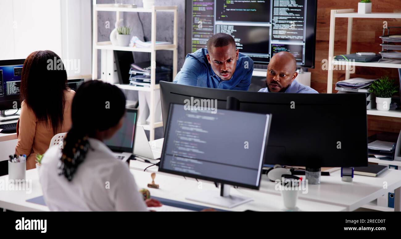 African Business Team Working On Computer. Software App Development Stock Photo
