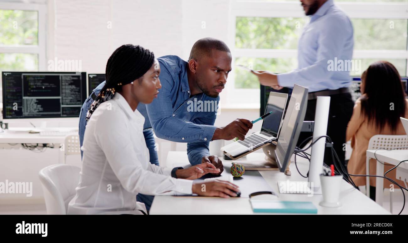 African Business Team Working On Computer. Software App Development Stock Photo