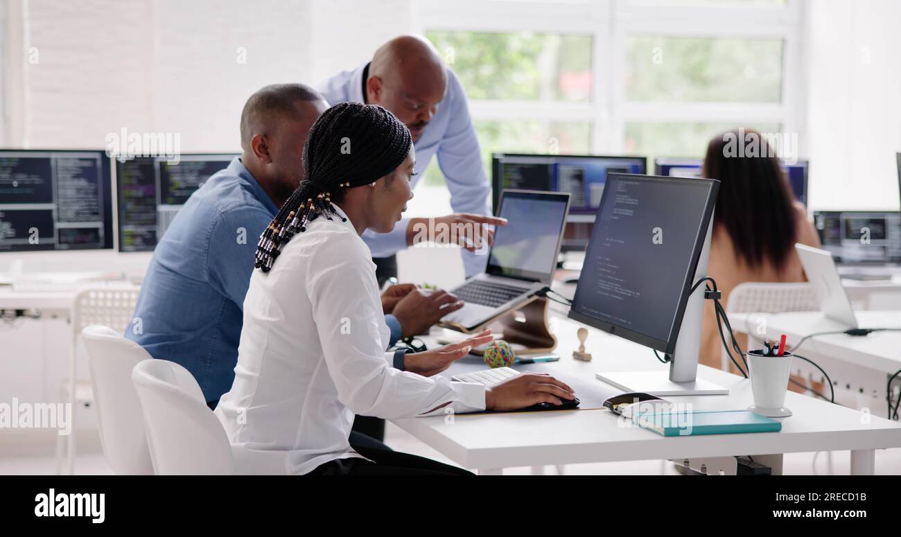 African Business Team Working On Computer. Software App Development Stock Photo