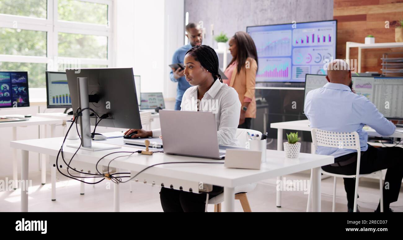 Professional Woman Using Computer Technology In Office Stock Photo