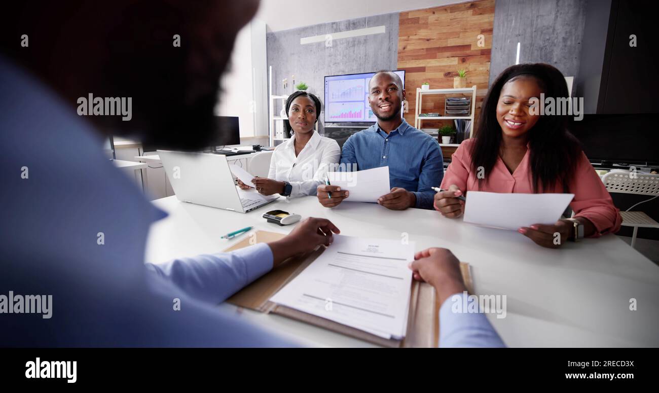 african-man-in-group-job-interview-corporate-employment-stock-photo