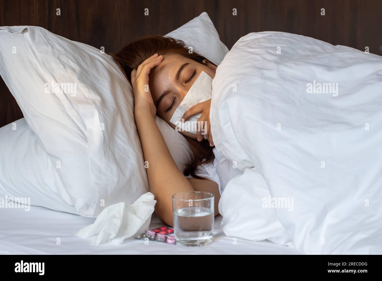Asian beautiful woman suffering from runny nose or nasal blocking ...