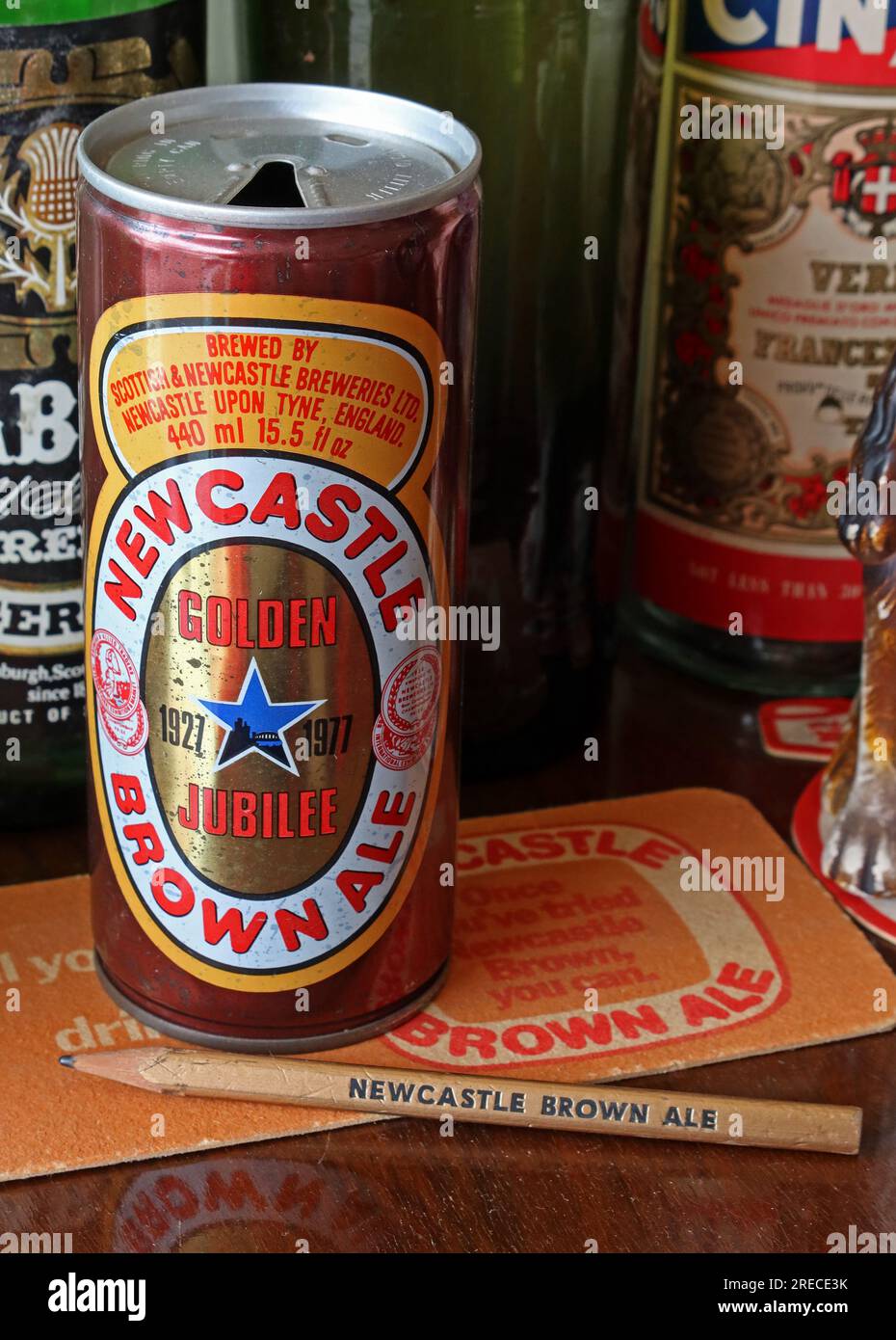 Newcastle Brown Ale, Golden Jubilee can , 1927,1977, with pencil and beer mat Stock Photo