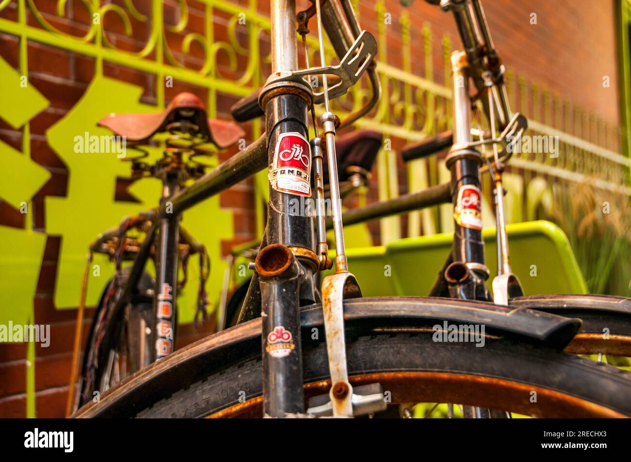 Two Yongjiu (Forever) classic bicycles at a bicycle rack outside the ...