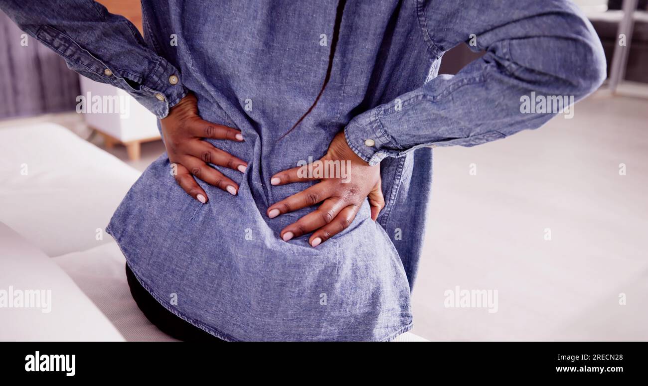African woman having back pain hi-res stock photography and images - Alamy