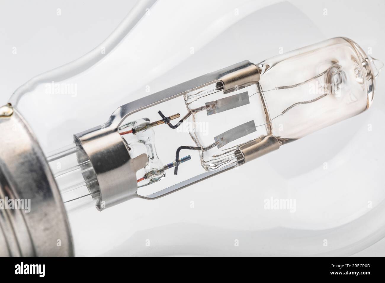 The connections and filament in a clear glass lightbulb Stock Photo Alamy