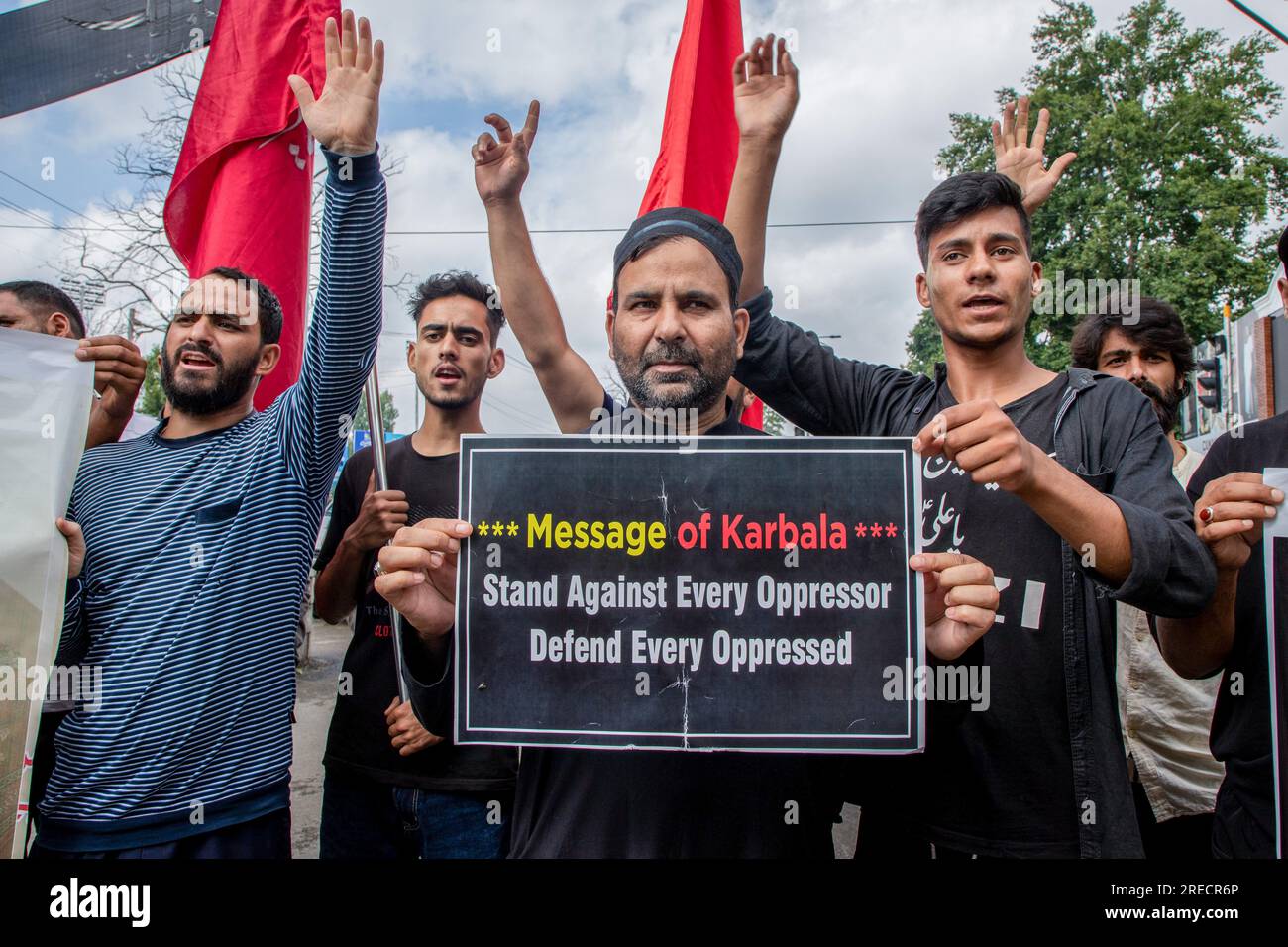 Kashmiri Shiite Muslim mourners raising religious slogans as they take ...