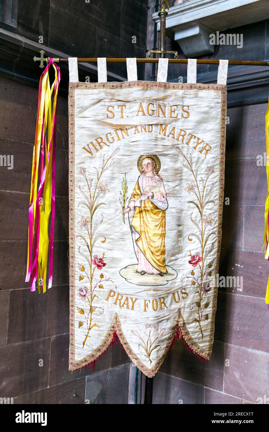 St Agnes Virgin and Martyr flag inside Manchester Cathedral, Manchester, Lancashire, England Stock Photo