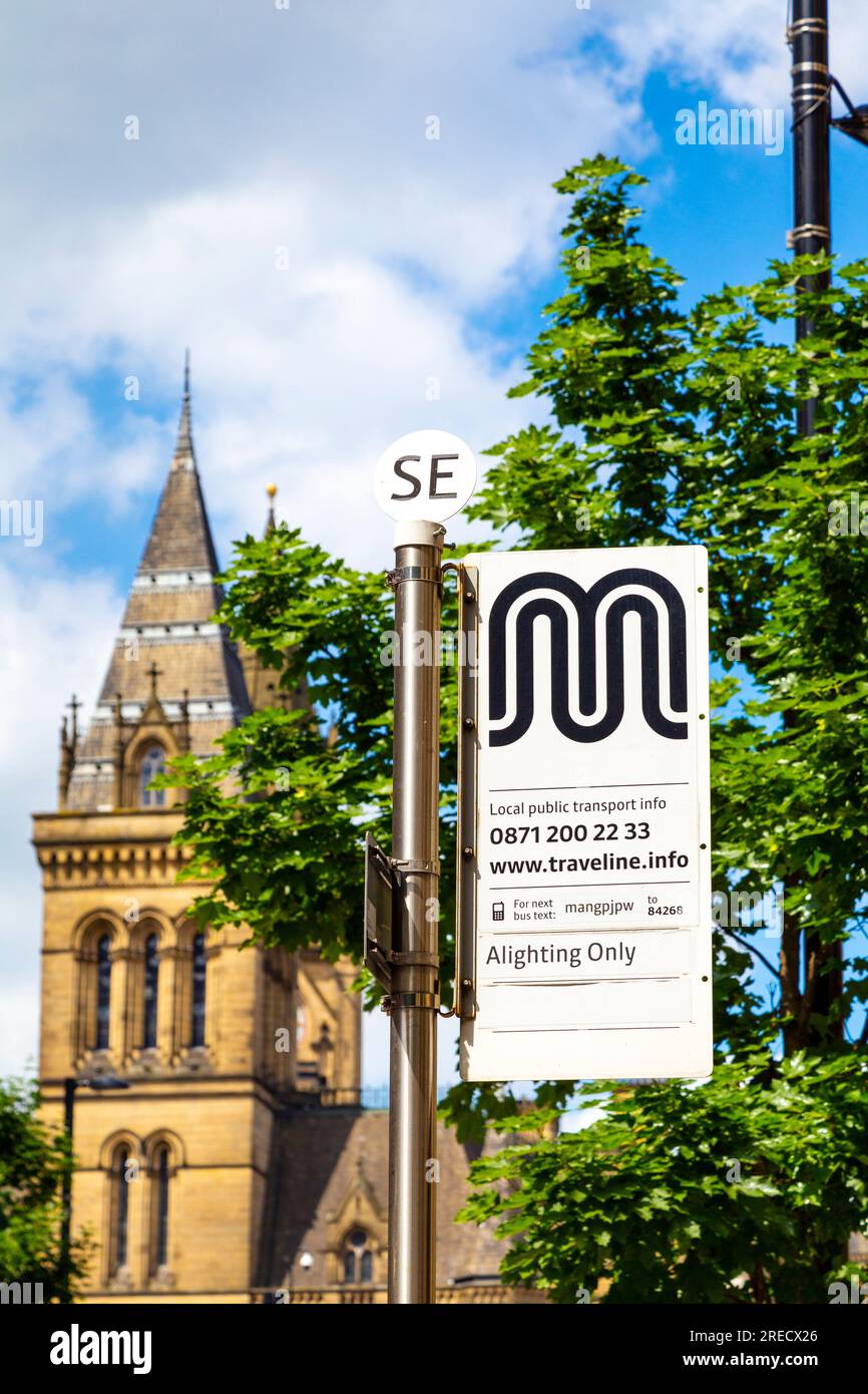 Bus stop sign on Princess Street with Manchester Town Hall in