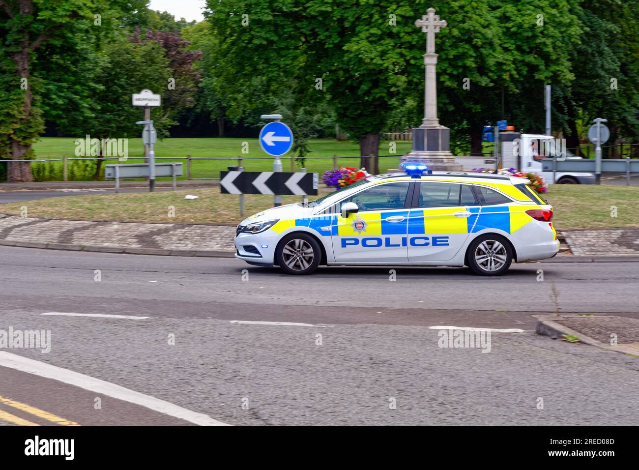 A Surrey police force car speeding on the blue lights on a public highway Shepperton Surrey England UK Stock Photo