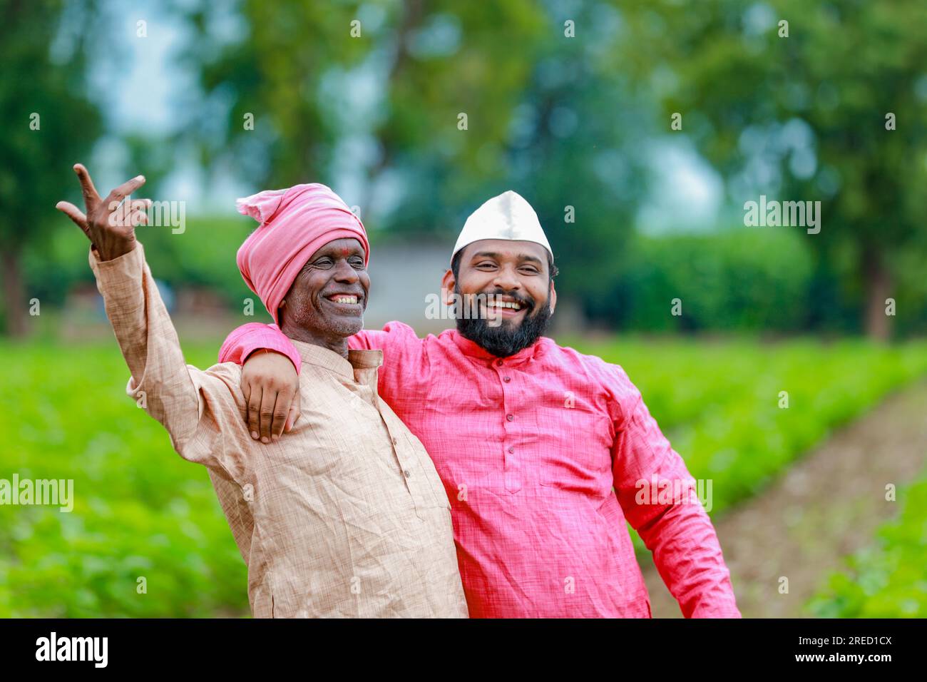 Indian farming, two farmer standing in farm , happy farmer , farmer and worker Stock Photo