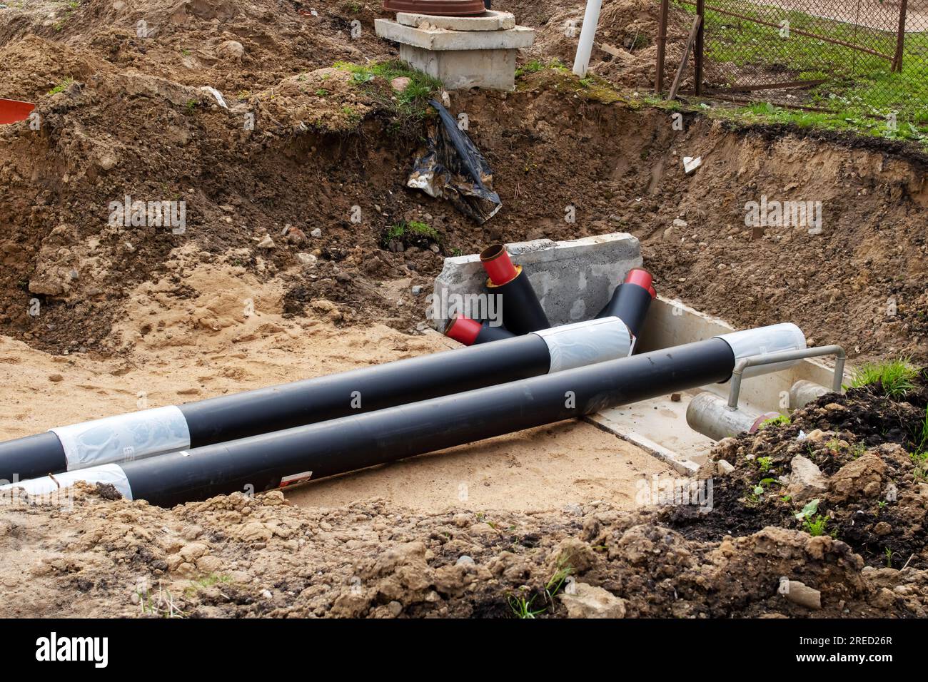 Pipes for heating water in the ground close up Stock Photo Alamy