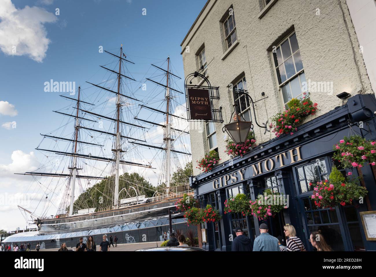 The Gipsy Moth public house next to the magnificent Cutty Sark tea clipper tall ship in Greenwich, London, England, U.K. Stock Photo