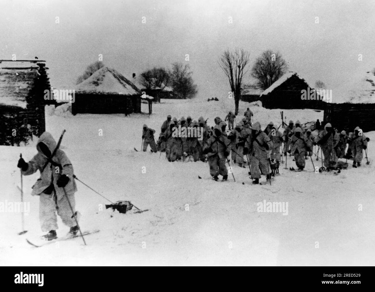German soldiers on skis leaving a village, probably middle section of ...
