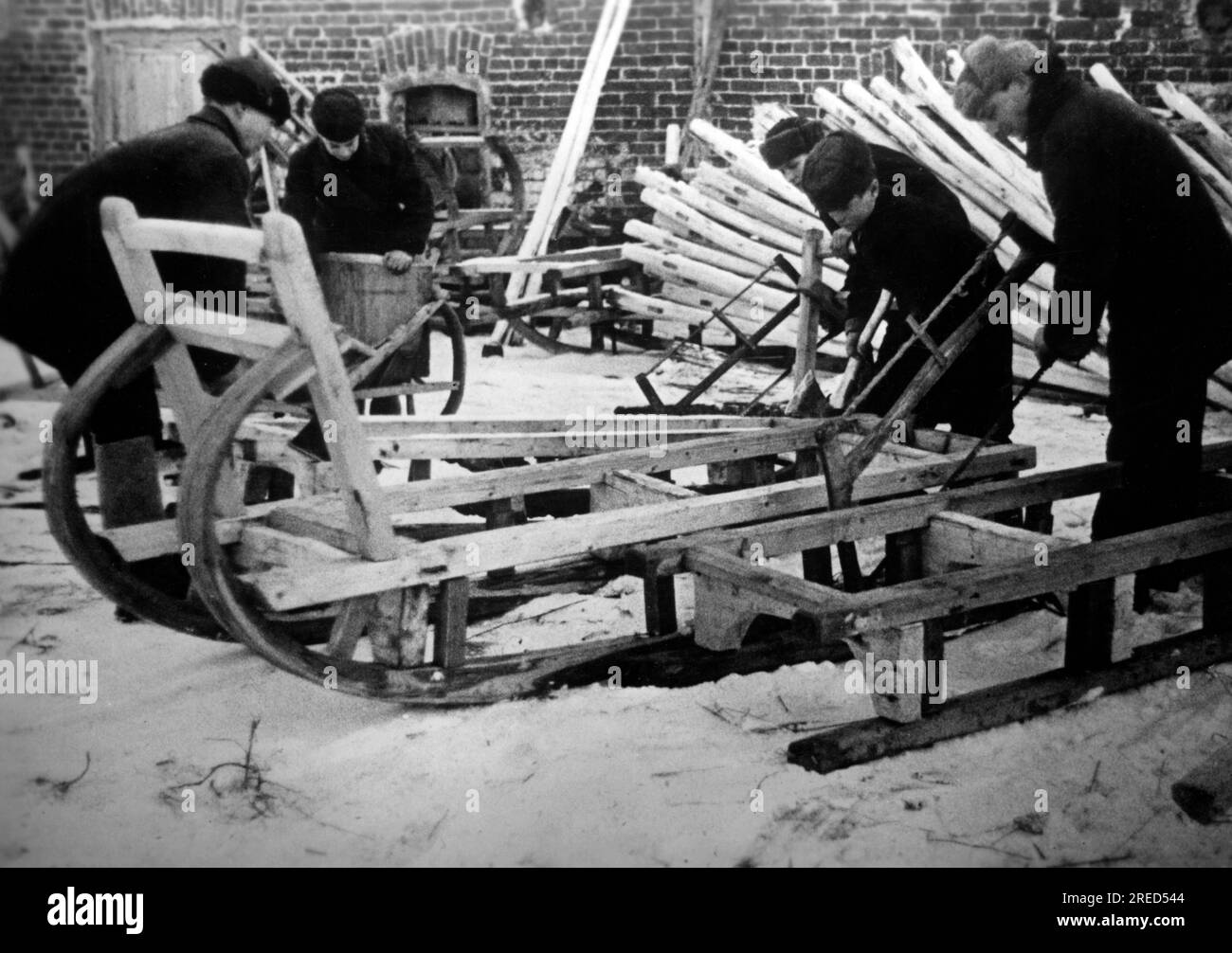 Russian villagers make sleds for the Wehrmacht near Borovsk. Photo