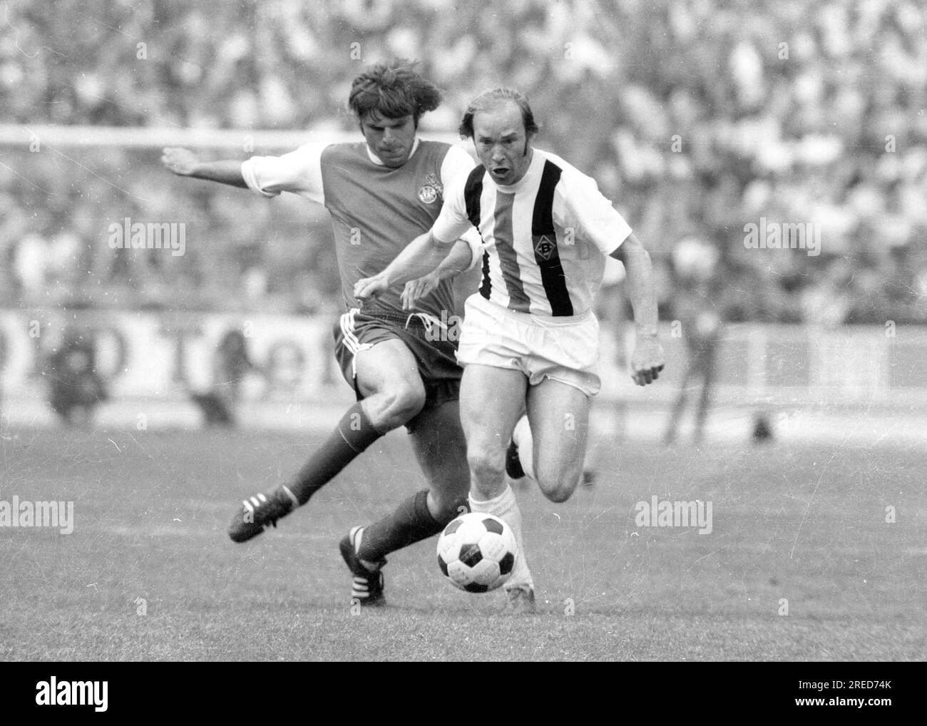 DFB Cup Final 1973: Borussia Mönchengladbach - 1. FC Köln 2:1 / Bernd Rupp (Borussia) action before Wolfgang Weber (1. FC Köln) [automated translation] Stock Photo