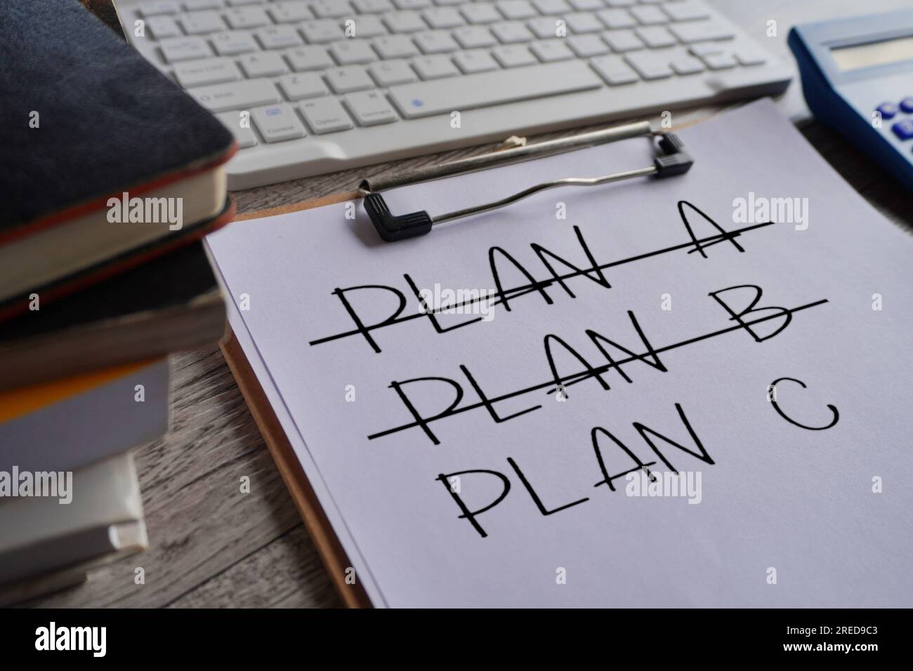 Crossing out Plan A and Plan B and writing Plan C. Concept for change of plan. Stock Photo