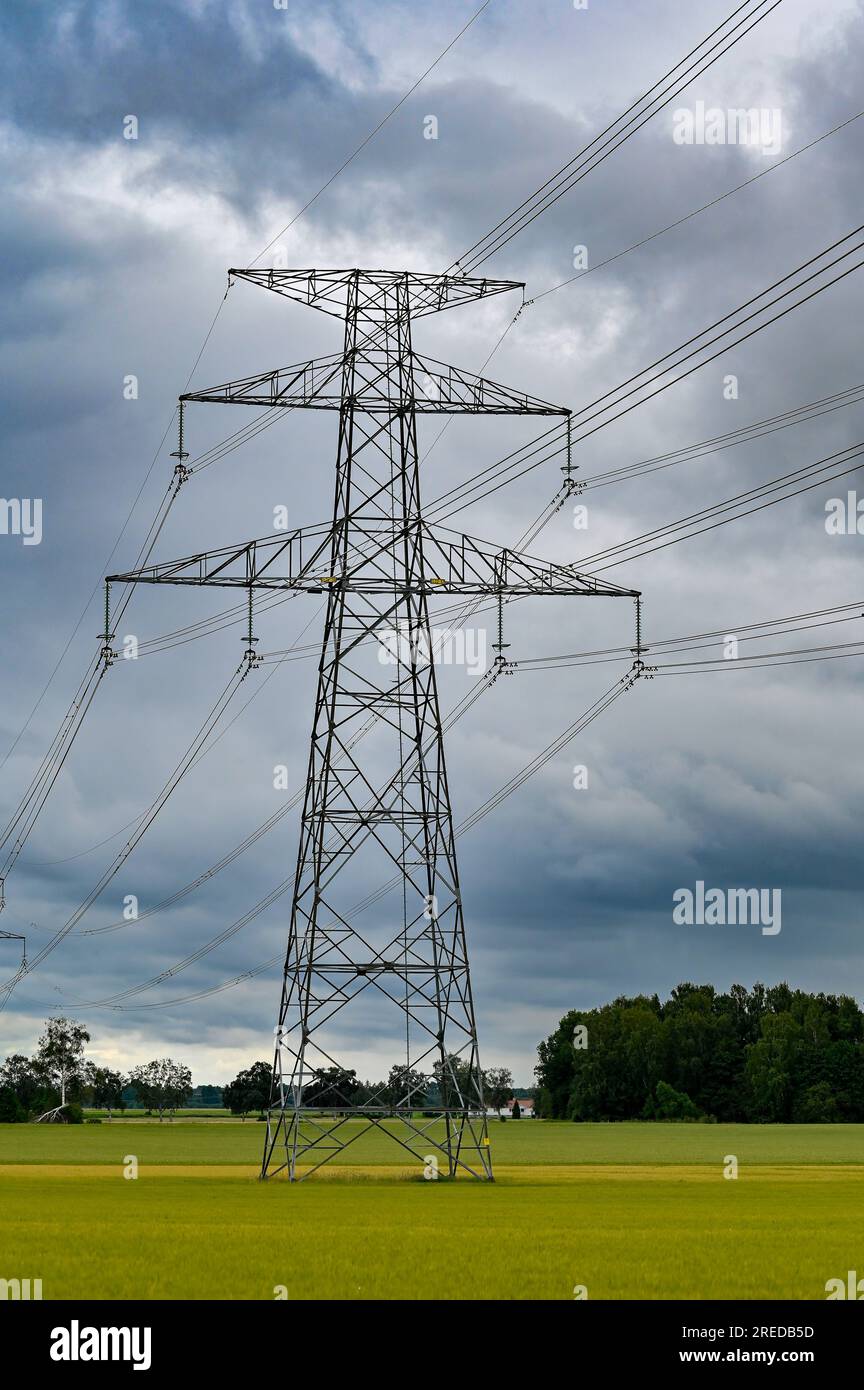 Power lines over fields a cloudy summers day Stock Photo - Alamy