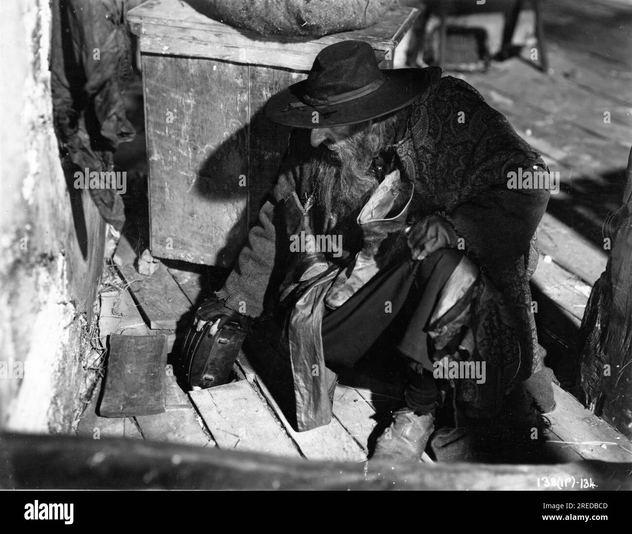 ALEC GUINNESS as Fagin hiding his money in OLIVER TWIST 1948 director DAVID LEAN novel Charles Dickens producer Ronald Neame Cineguild / General Film Distributors (GFD) Stock Photo