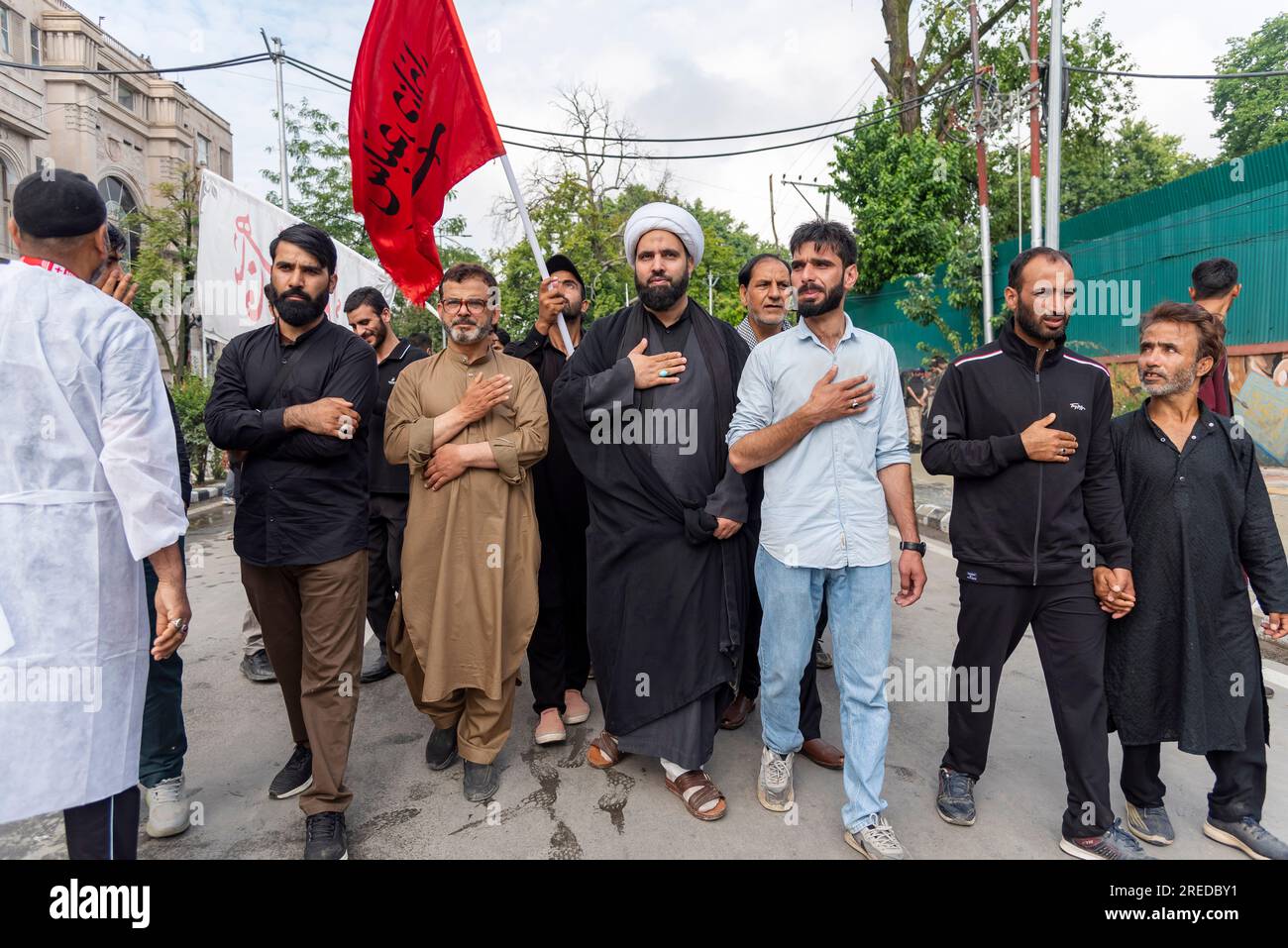 Shia Muslims take part in a procession on the 8th day of Muharram