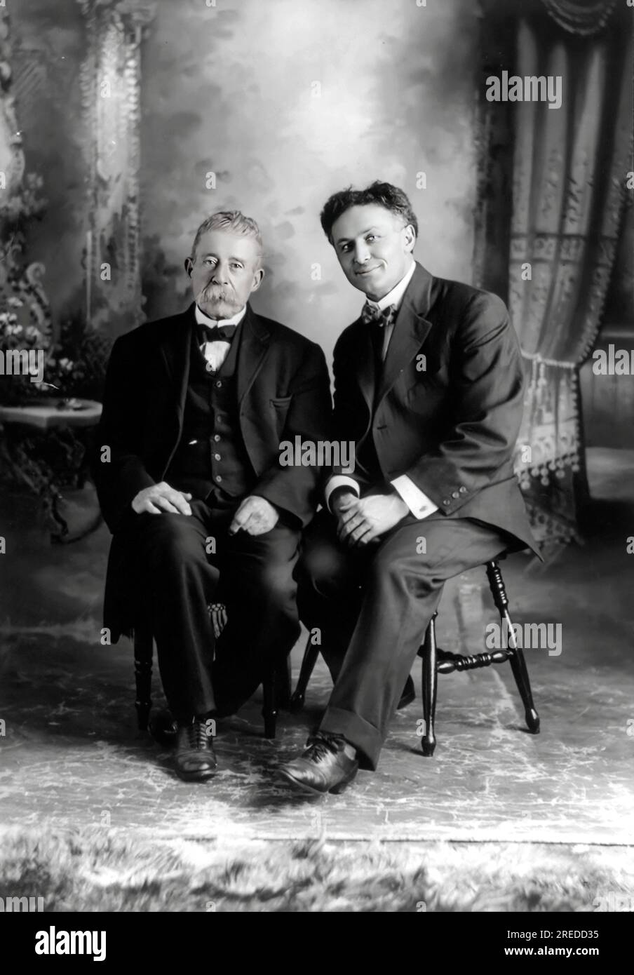 Houdini with Ira Davenport, full-length portrait, seated Stock Photo