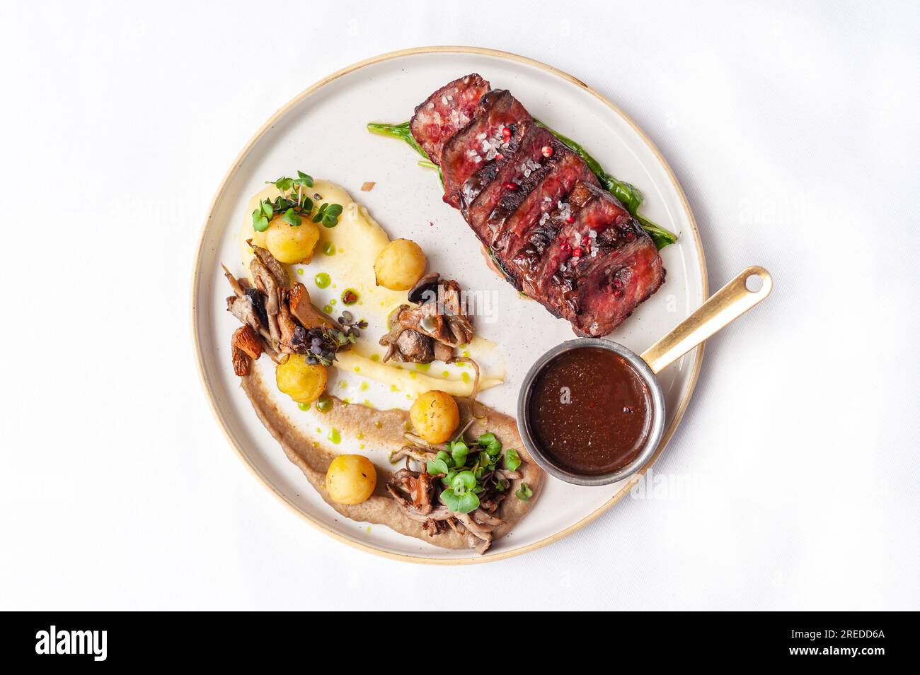 Beef steak with mushrooms and potatoes with demiglace sauce Stock Photo Alamy